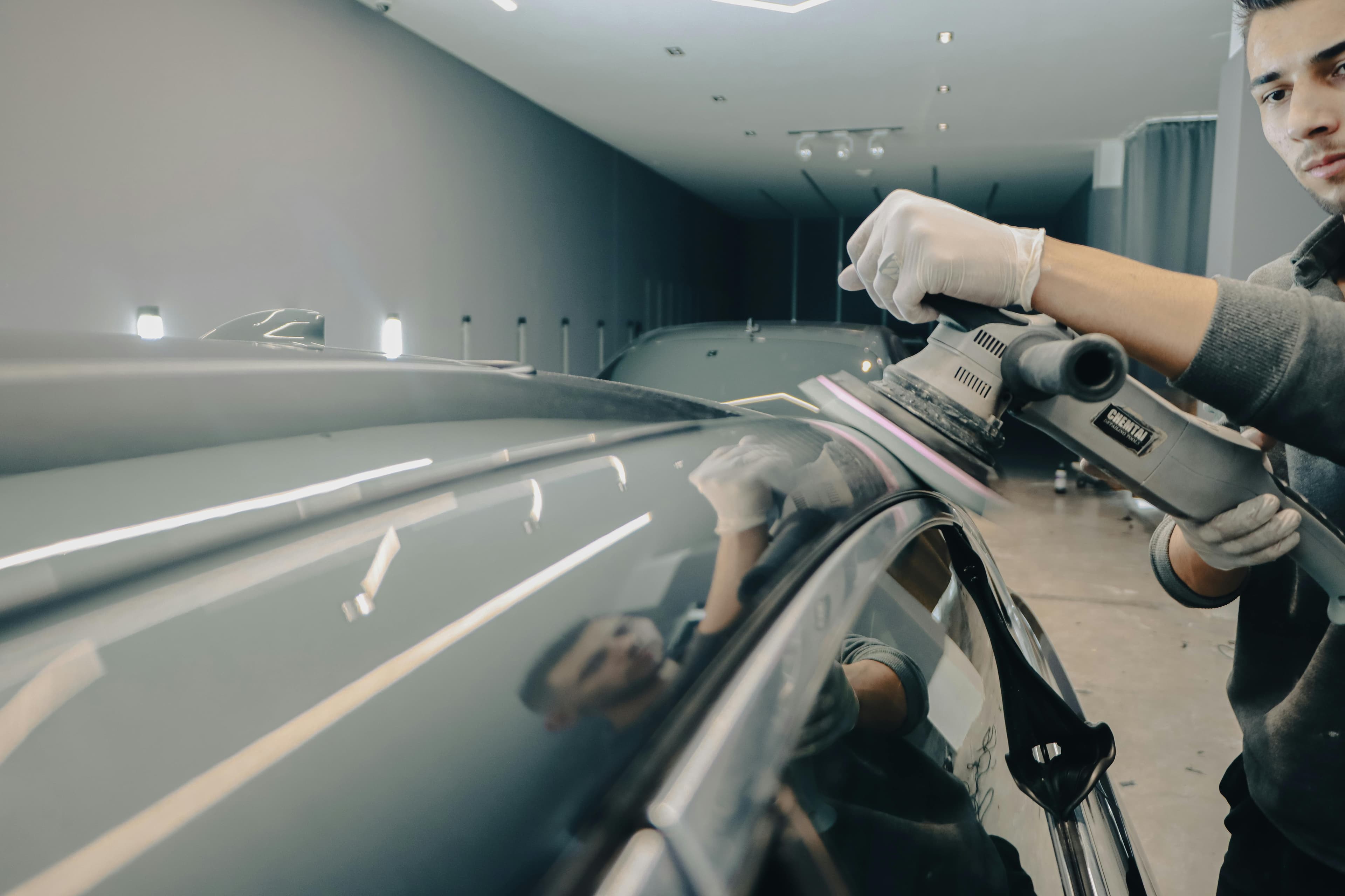 Worker polishing a granite countertop